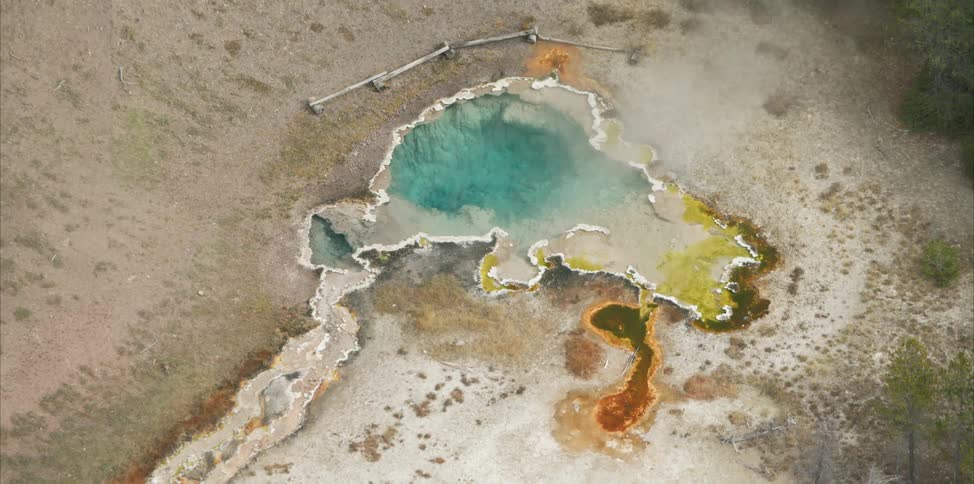 A hot spring sits in the middle of a desert