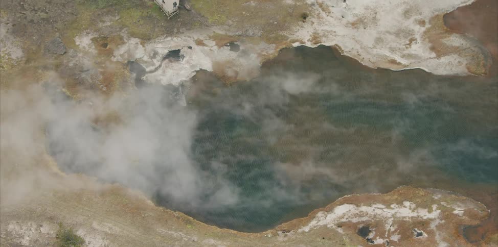 An aerial view of steam above a body of water