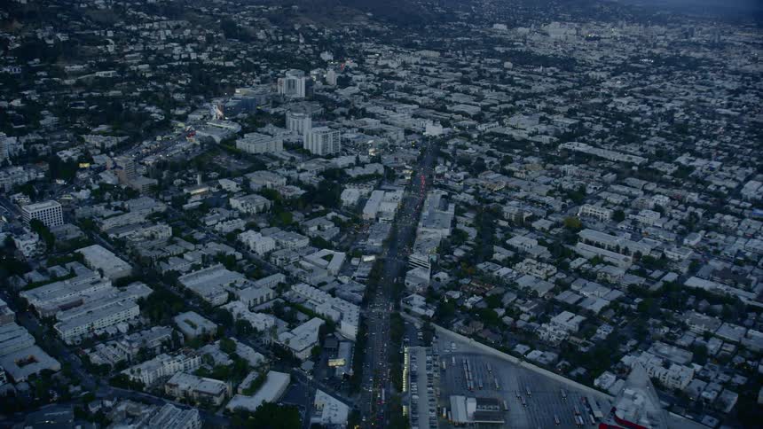 A large neighborhood with houses buildings and roadways