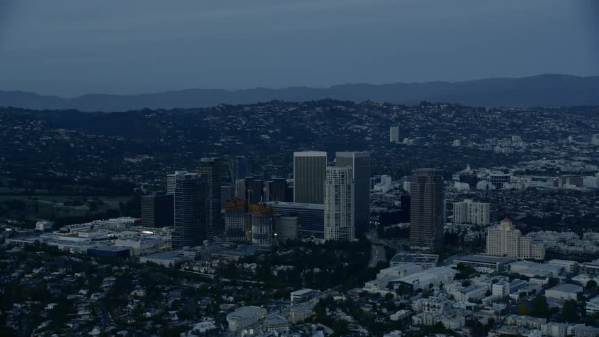 A city skyline with buildings and the sky in the background