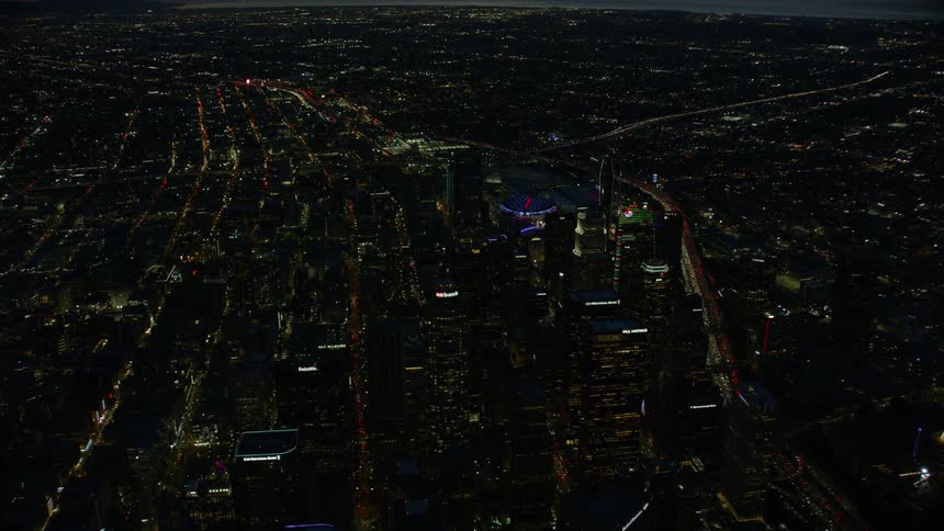 Aerial view Downtown Los Angeles (DTLA) at sunset with ocean backdrop