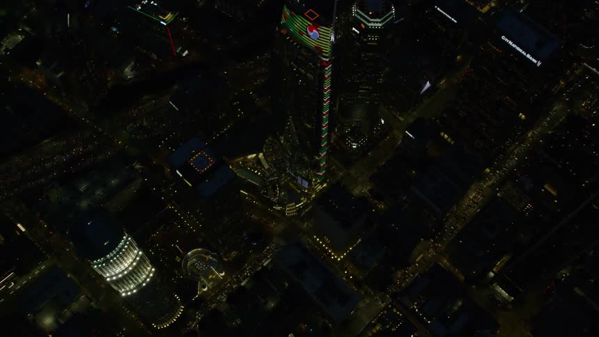 A city at night with buildings skyscrapers and roads