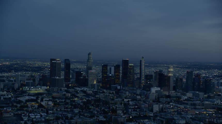 An aerial view of a downtown city is displayed