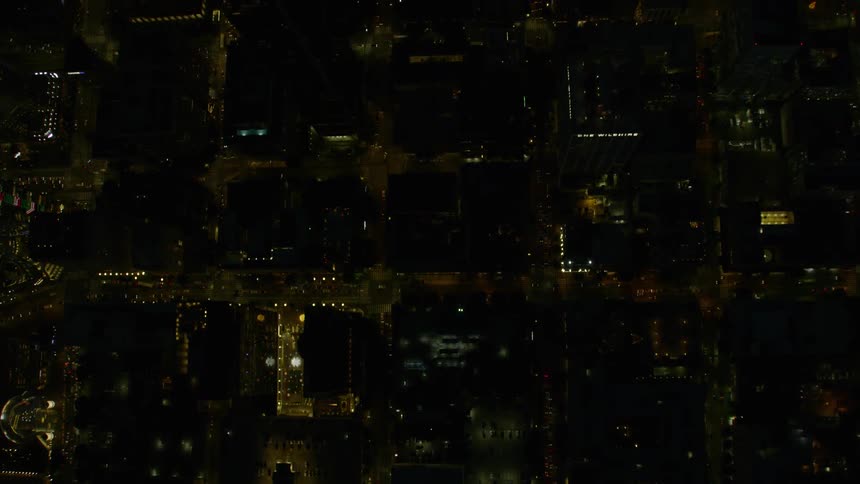 An aerial view of a downtown city at night