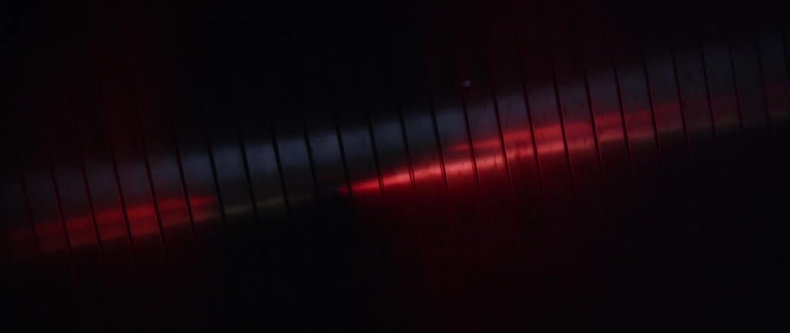 Light shines off a metallic surface
