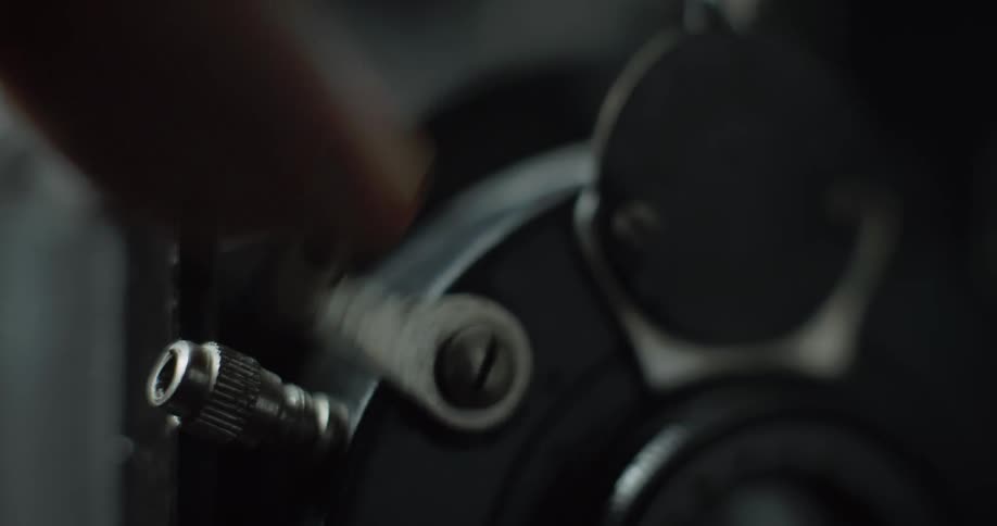 Close up of a man pushing a lever