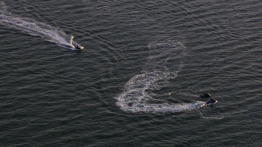 Boats turning in the water