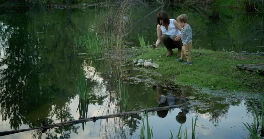 A woman and child choose rocks