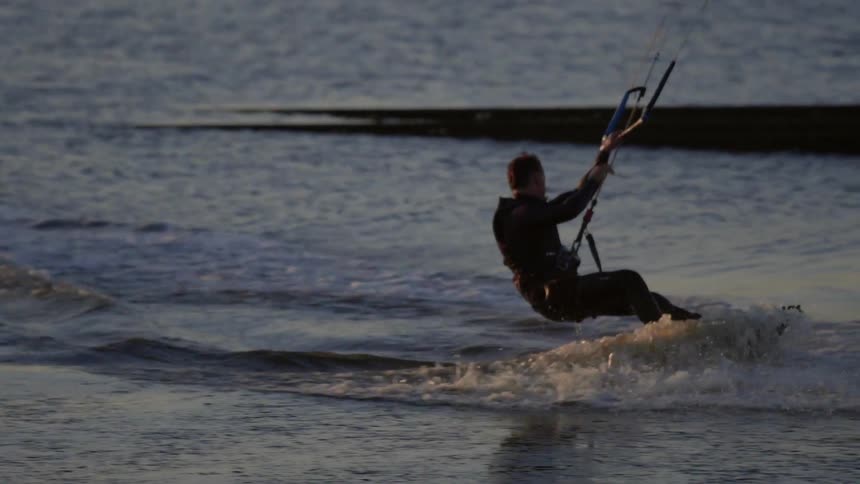 A man kite surfing