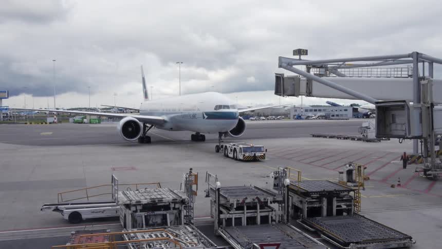 A plane pulling into an airport
