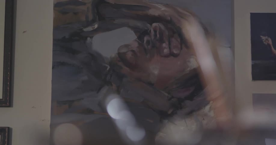 A painting of a man with his hands on his face