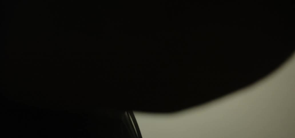 A man working with sweat dripping off his face