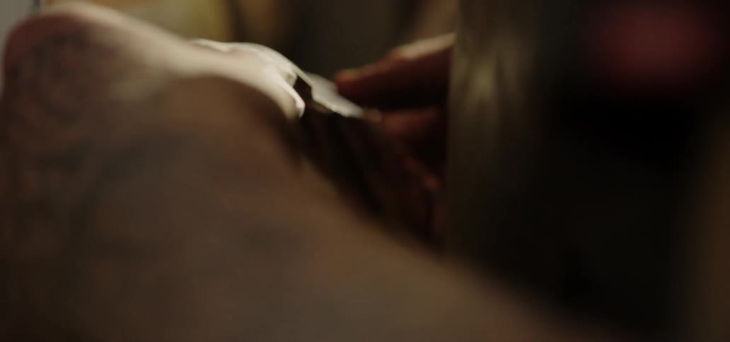 Male hands feeling handle of a knife