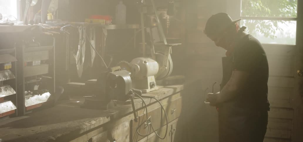 A man removes his glasses