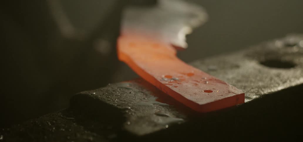 Hot metal being hit with a blacksmiths hammer