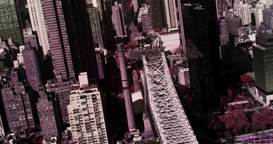 A bridge with buildings and skyscrapers in the background