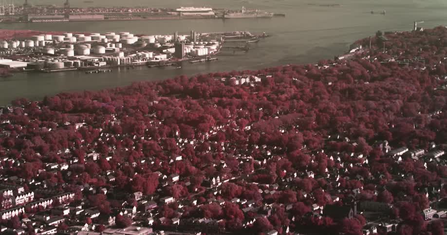 A city stretches out below in monochrome