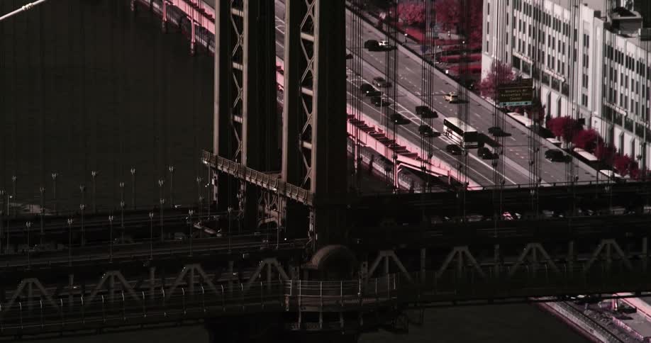 A large bridge across a body of water in a city