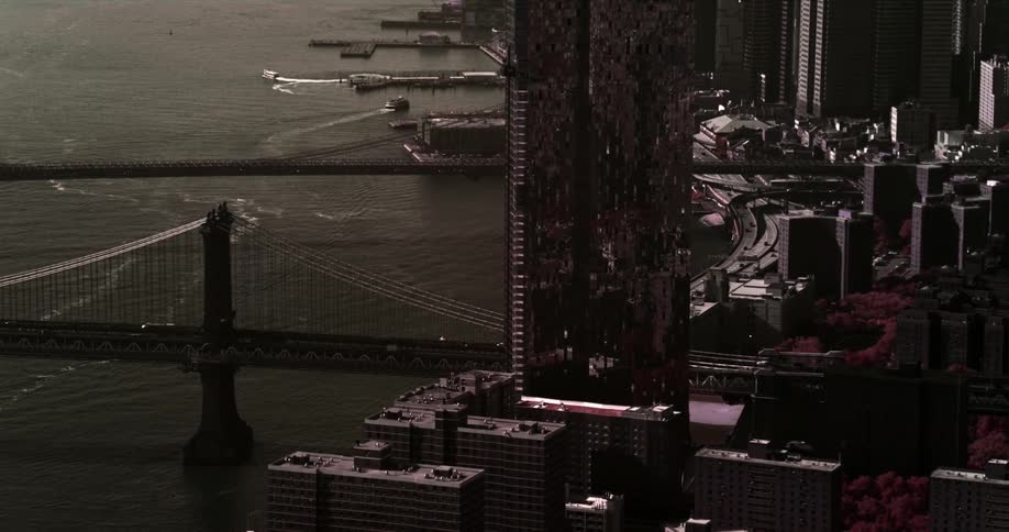 The vehicles drive into the dark city below