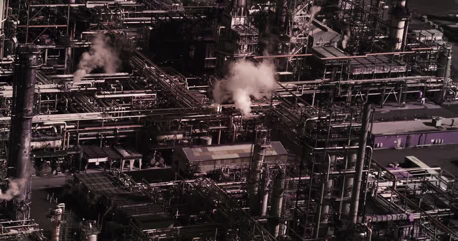An aerial view of pollution rising from a factory