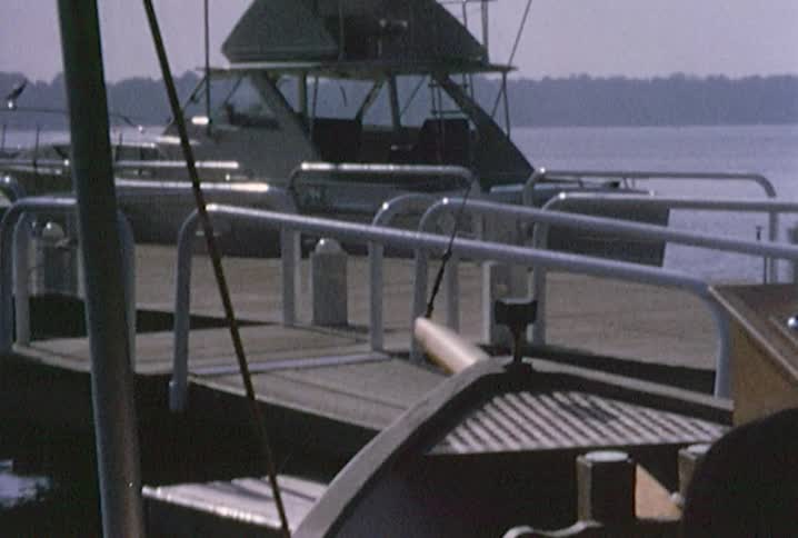 Boat docking with a group of people aboard it