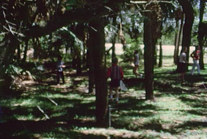 Many children run through the grass hunting for easter eggs