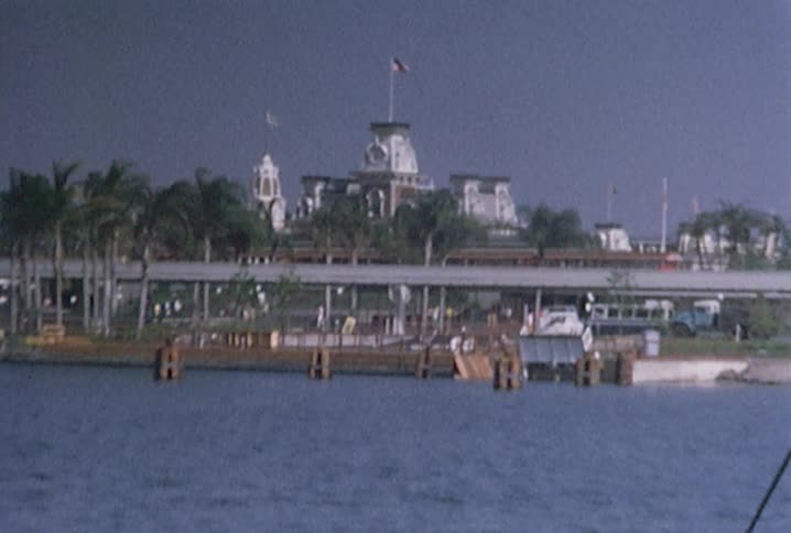 Riding a boat over the water and looking at a castle