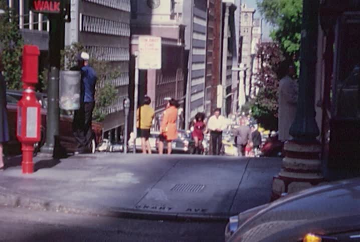 People walking up and down a busy city street