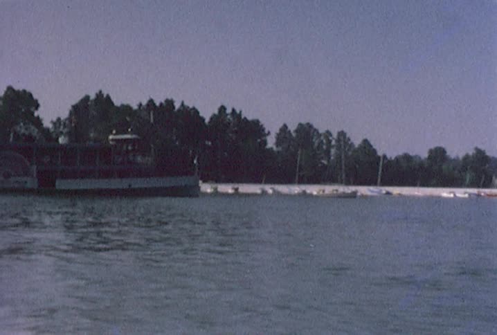A large boat sits near the shore