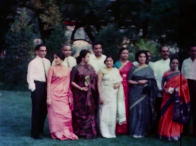 A group of men and women lining up for a picture
