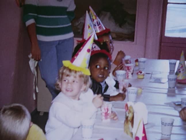 Small children eating ice cream at a birthday party