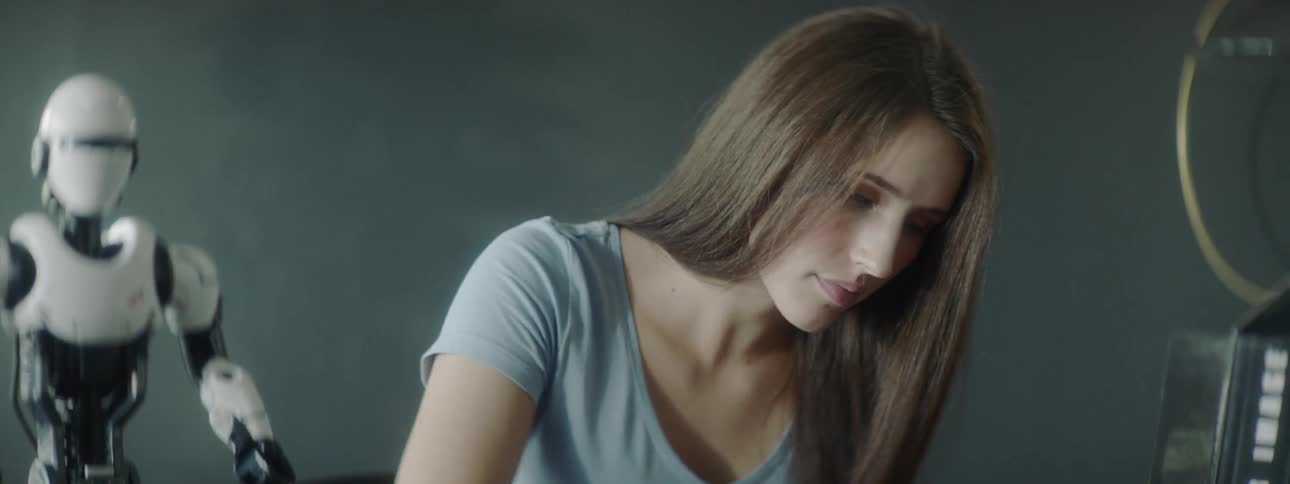 A young girl studies a paper