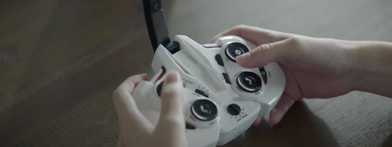 A person uses controler to play video games