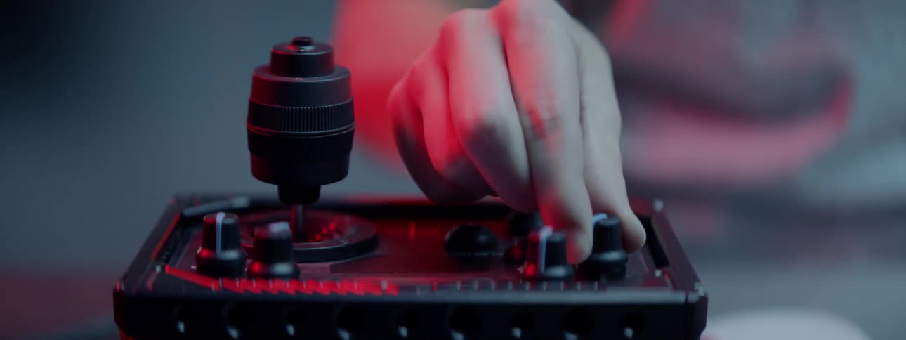 Person adjusts settings on control pad