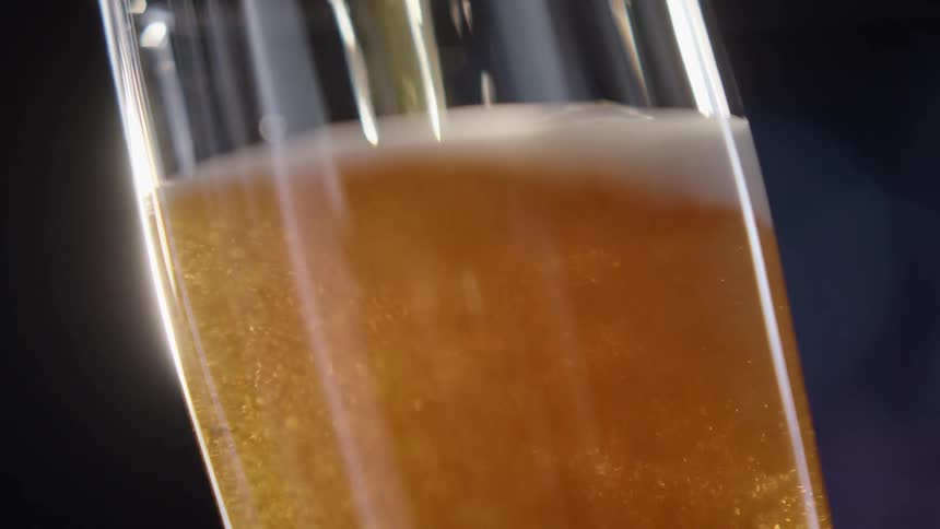 A beer is being poured in to a glass