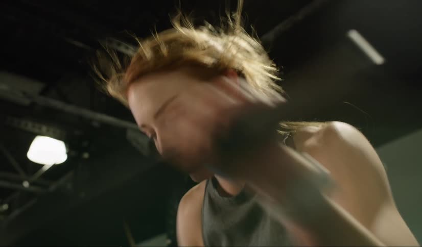 Woman works out on an exercise machine