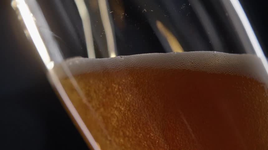 Beer is being poured into a glass