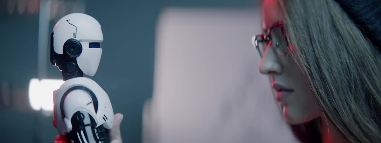 White woman assessing a robotic toy