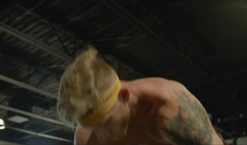 A man lifts a barbell from the floor to overhead then drops it