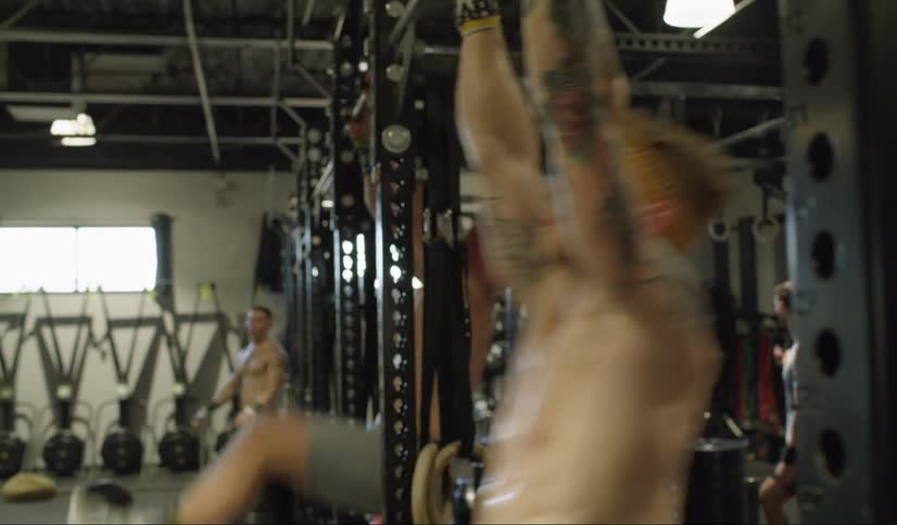 People exercising in a gym during the day