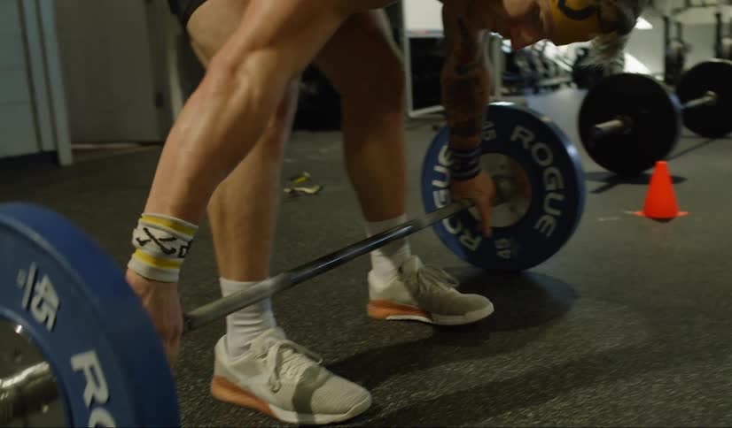 A man lifts at the gym