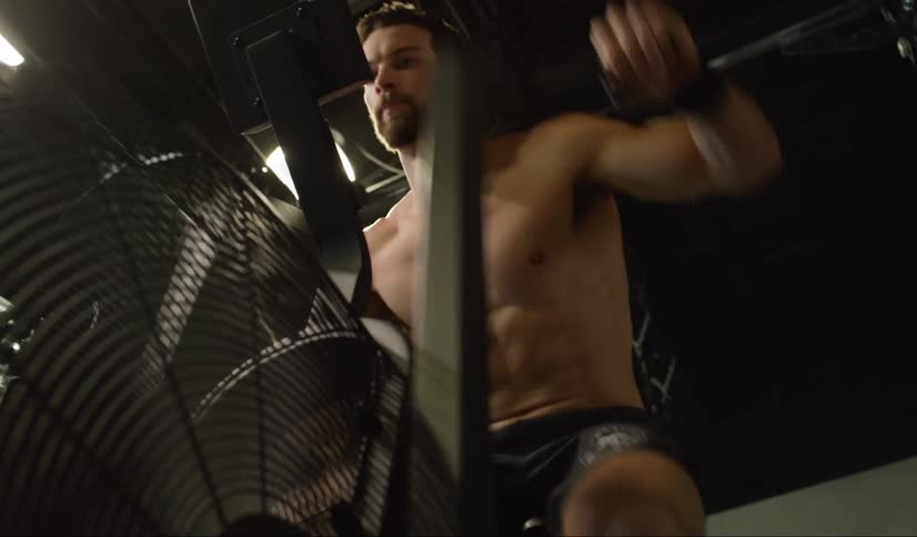 Man working out on an airdyne bike indoors