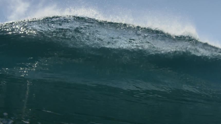 cinematic slow motion wave crashing into lens