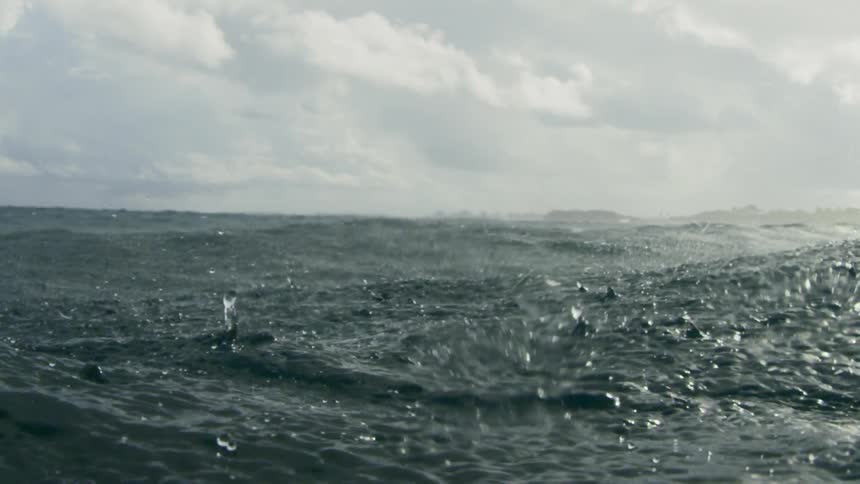 Rain falls on the ocean