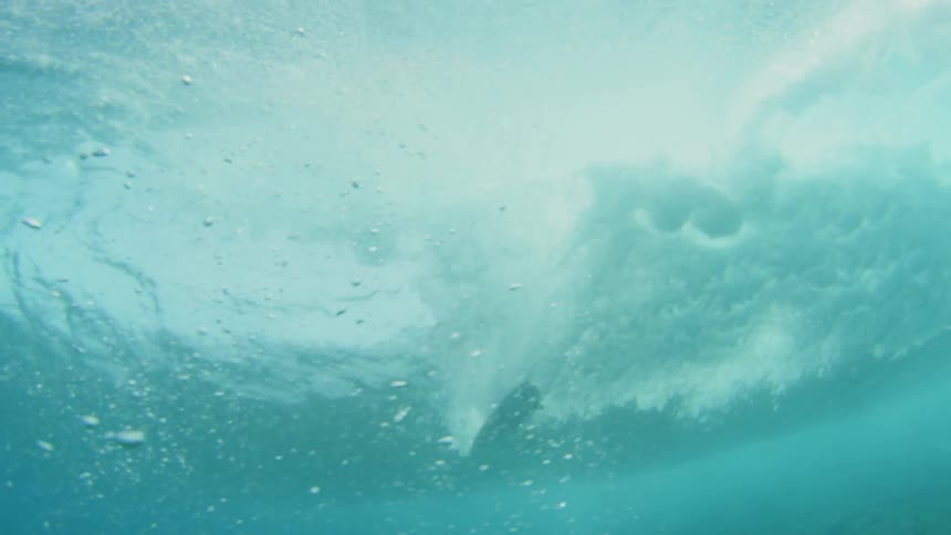 Underwater view of a person surfing