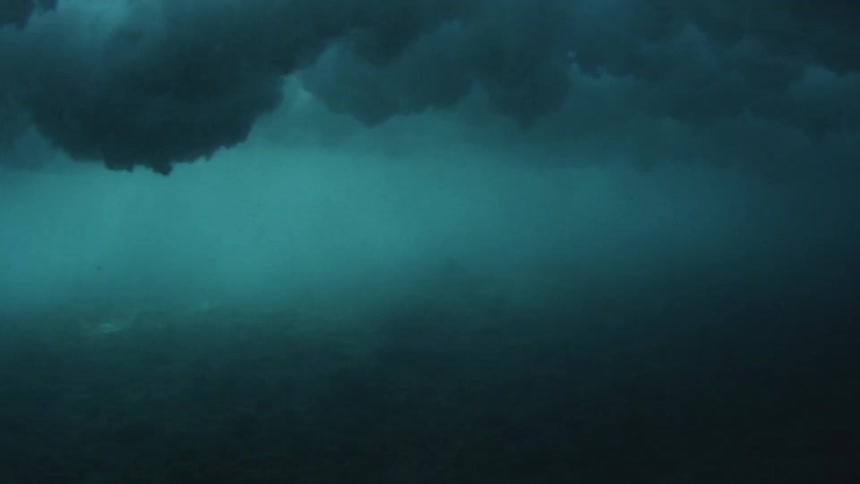 Underwater view of waves crashing
