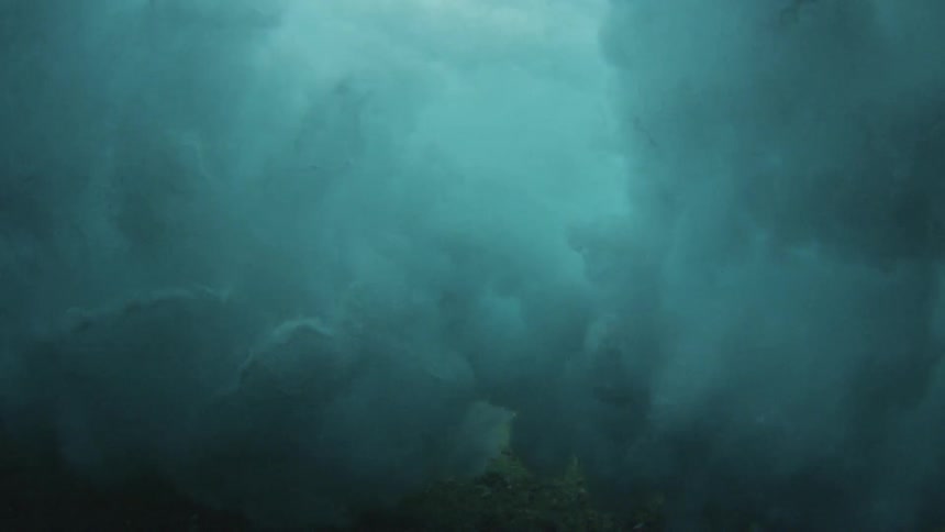 Ocean waves from under the surface as they roll and crash