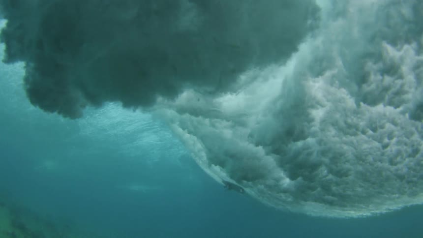 Underwater shot of surfboard on the water