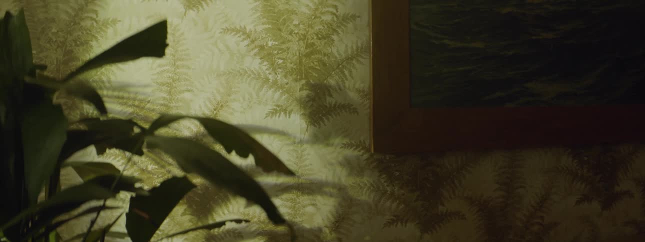 A wall covered in fern wallpaper