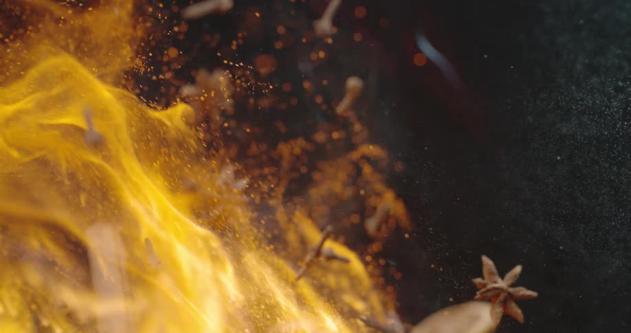 Flames burst in to view as debris is thrown up in the air